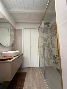 a bathroom with a sink and a shower at Casa Amor Iseo Lake in Riva di Solto +25 photos