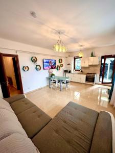 a living room with a couch and a table at Arcadia Apartament Mamaia Nord in Mamaia Sat/Năvodari