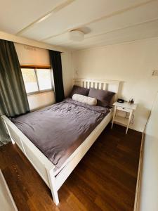 a bedroom with a bed in a small room at Hofquartier Greven in Greven