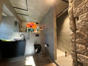 a small bathroom with a sink and a counter at Gleisbett 12-3 in Meiningen +22 photos