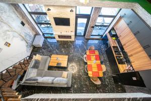 an overhead view of a living room with a snowboard on the floor at Qafqaz Cabana Chalet in Gabala