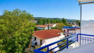 a view of a city from a balcony at Siviri Sea & Forest-Cozy Apartment with Garden & Nature Views in Siviri