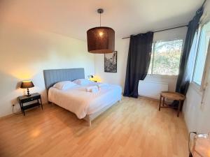 a bedroom with a bed and a large window at Villa Arethuse - Pyla sur Mer in Pyla-sur-Mer +17 photos