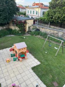 an aerial view of a backyard with a playground at Alle Pratoline Casa vacanze spaziosa vicino Trieste e mare con deposito bici e moto coperto in Muggia