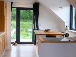 a kitchen with a door leading to a yard at Pheasants Call in Kenmare