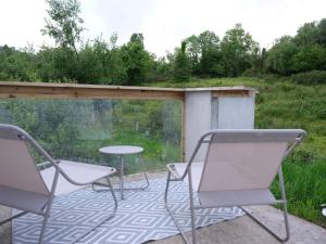two chairs and a table on a patio at Pheasants Call in Kenmare