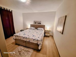 a bedroom with a large bed in a room at Vacation Home Katarina in Nin