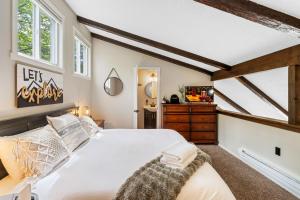 a bedroom with a large white bed and windows at Ski-OnSki-Off Camelback Arcade Pool in Tannersville +60 photos