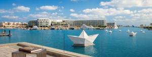 a view of a marina with boats in the water at Apartment at Vida Marina Marassi, North Coast in El Alamein