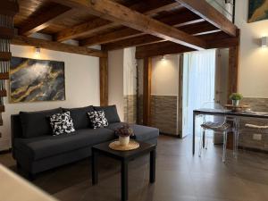 a living room with a couch and a table at CasaCastellett in Modica