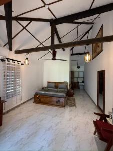 a large bedroom with a bed in a room at 108 Palms Beach Resort in Trincomalee