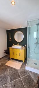 a bathroom with a yellow sink and a mirror at Les Limousines - Proche de Pairi Daiza, Mons, Soignies in Soignies