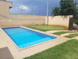 a swimming pool in the yard of a house at quiet corner in Sao Jose do Rio Preto
