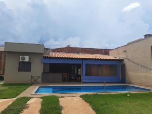 a house with a swimming pool in front of it at quiet corner in Sao Jose do Rio Preto
