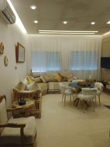 a living room with a couch and a table at Velvet View Tangier in Tangier
