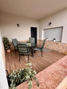 a patio with a table and chairs in a living room at Mirador de Molinicos in Molinicos