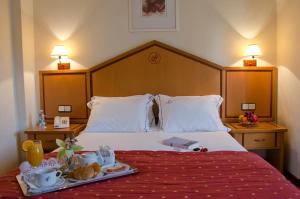 Cama o camas de una habitación en VIP Inn Berna Hotel