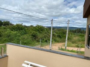 a white bench sitting on top of a balcony at Apartamento no Crato, conforto e praticidade! in Crato +4 photos