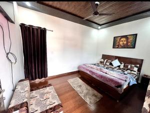 a bedroom with a bed in a room at Kedar velley in Phata