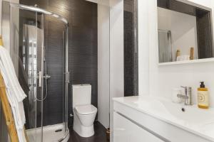 a bathroom with a shower and a toilet and a sink at Chateau Belomonte in Porto +33 photos