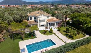 an aerial view of a house with a swimming pool at Violet Luxury Villa in Lefkada