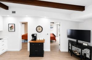 a living room with a flat screen tv on a wall at Happy Harbor at Kimberling Crossing in Kimberling City