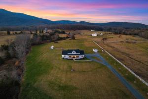an aerial view of a house in the middle of a field at Afton Awaits in Afton