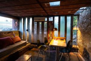 a room with a bed and a table and chairs at Apart Domus in San Javier