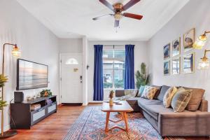 a living room with a couch and a ceiling fan at The Prairie at Brighton - UF , Pool , Workspace in Gainesville