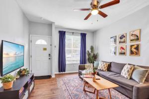 a living room with a couch and a ceiling fan at The Prairie at Brighton - UF , Pool , Workspace in Gainesville