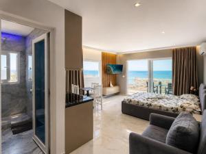 a bedroom with a bed and a view of the ocean at Eri Apartments in Durrës