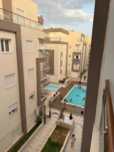 an overhead view of a swimming pool in a building at Zaineb in Hammamet Sud