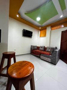 a living room with a couch and a table at CASA Sebastián in Puerto Baquerizo Moreno