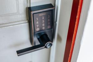 a close up of a door with a clock on it at Red Bud Suite in Staunton +23 photos