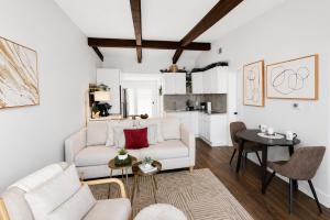 a living room with a white couch and a table at Lake it Easy at Kimberling Crossing in Kimberling City