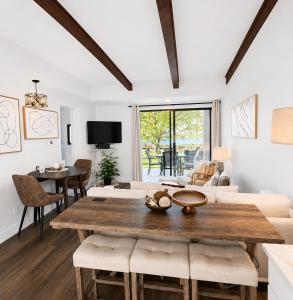 a living room with a wooden table and chairs at Lake it Easy at Kimberling Crossing in Kimberling City