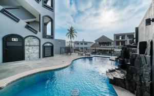 a swimming pool in the backyard of a house at Casa Del Toro in Barra de Navidad