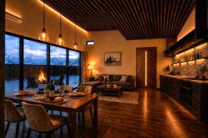 a living room with a couch and a table at 雪灯庵 in Iiyama