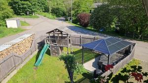 a playground with a slide and a play structure at Ankommen und loswandern Familien und Hundeurlaub im Hochschwarzwald Ferienwohnung Haus Maria in St. Blasien