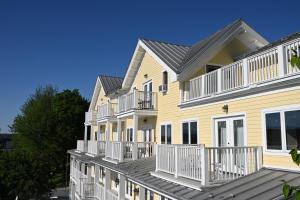 a row of houses with white balconies at Rhinecliff Hotel in Rhinecliff