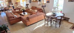 a living room with a couch and a table at Villanath in Bellegarde-sur-Valserine +38 photos