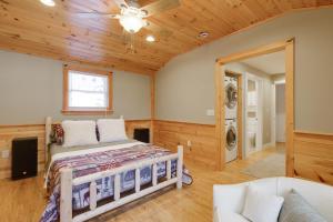a bedroom with a bed and a ceiling fan at Waterfront Deck + Views: Schroon Lake Sanctuary in Schroon Lake