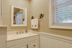 a white bathroom with a sink and a mirror at Waterfront Deck + Views: Schroon Lake Sanctuary in Schroon Lake +24 photos