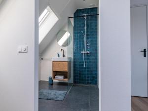 a bathroom with a shower and a sink at Fantastic villa located by a lake in Sint Nicolaasga
