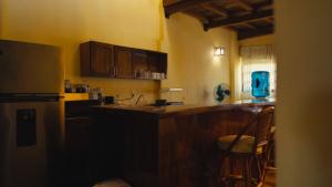 a kitchen with a counter top and a refrigerator at Verde Luna in San Francisco