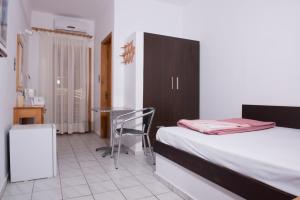 Postel nebo postele na pokoji v ubytování Alexander Beach Hotel