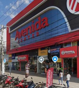 a group of motorcycles parked in front of a store at Flat Lucidata in Feira de Santana