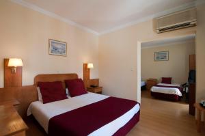 Cama ou camas em um quarto em Hotel Solneve