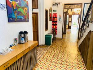 a kitchen with a counter and a tile floor at Encanto Hotel Boutique in Santa Marta