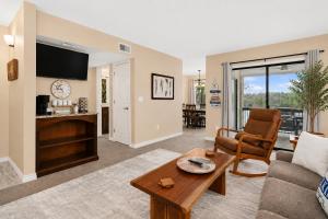 a living room with a couch and a table at The Perch at Kimberling Crossing in Kimberling City